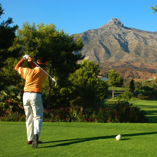 Man Golfer and Tee Shot at Aloha Golf, Costa del Sol, Spain