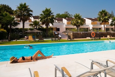 Lazing by the Encinar de Sotogrande Hotel pool