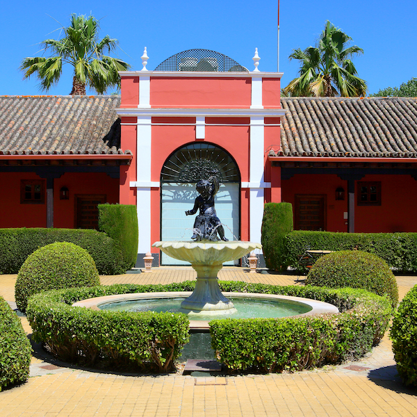 Entranceway to Montenmedio Golf Resort with gardens in the foreground