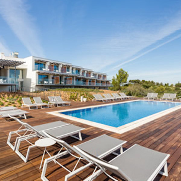 Sun beds by the pool at Onyria Palmares Hotel