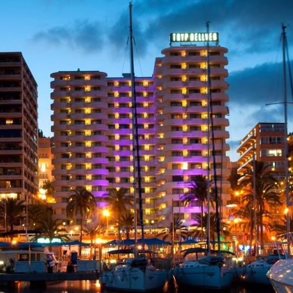 Night time shot of Palma Bellver Hotel with marina in the foreground
