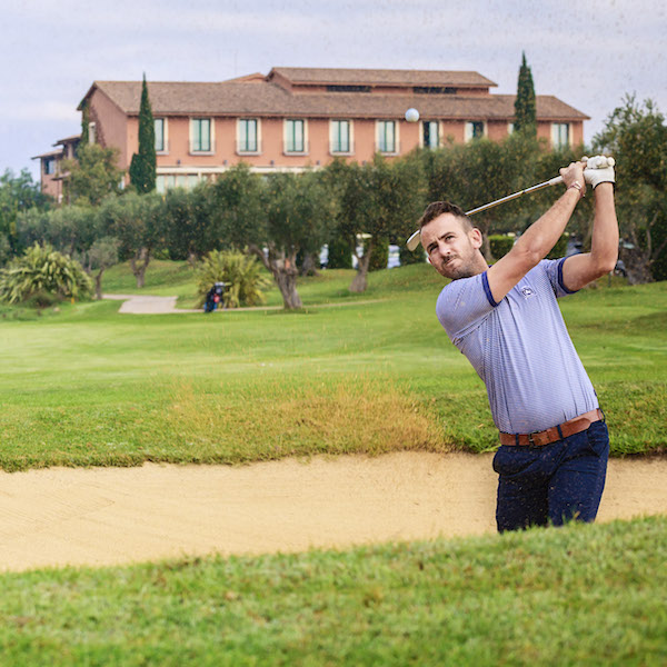 Male golfer in bunker at Peralada Golf, Costa Brava