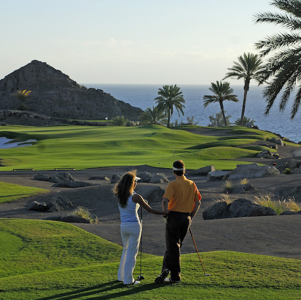 Two golfers survey the beauty of Anfi Tauro Golf, Gran Canaria