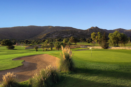 Large bunker guards this green at Capdepera Golf