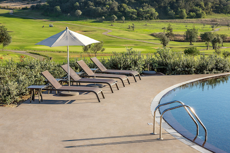 A quiet area to sit in the sun near the pool
