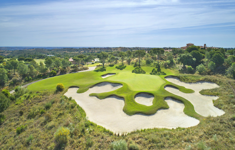 Bunkers guard a green on Monte Rei Golf