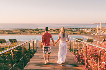 Walk down the boardwalk at Palmares Beach House Hotel