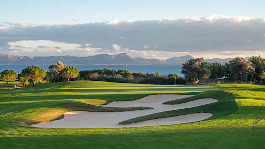 Large bunker guards a green on Alcanada Golf