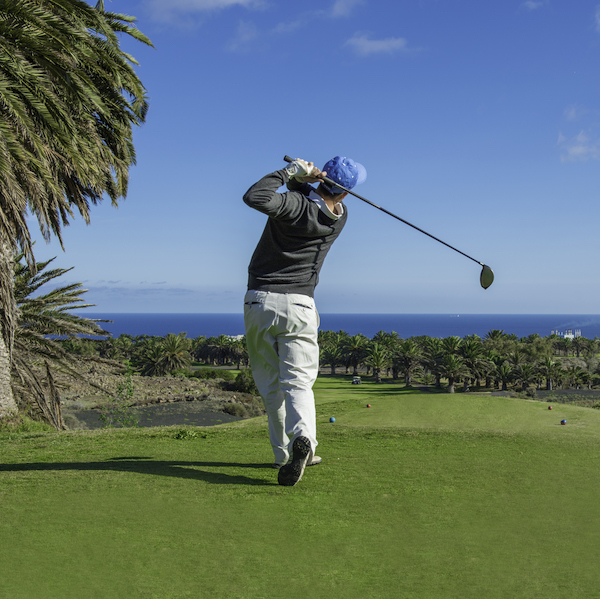 Male golfer hits from the white tees on Costa Teguise Golf