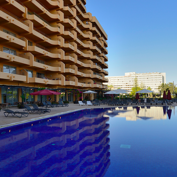 View of pool and apartments at Dom Pedro Portobelo Aparthotel in Vilamoura