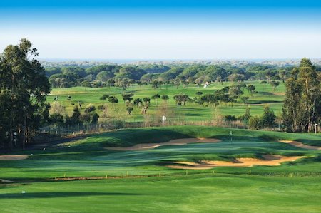 Bunkers surround the green on the 9th hole on El Rompido South Course
