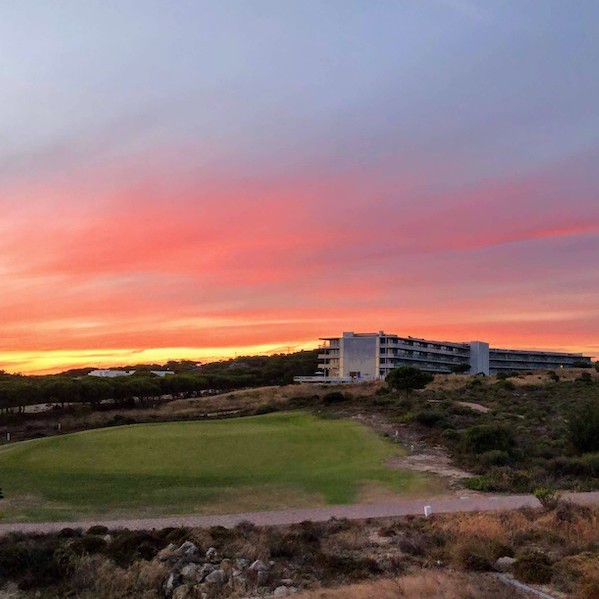 Sunset over The Oitavos Hotel and golf course in Cascais
